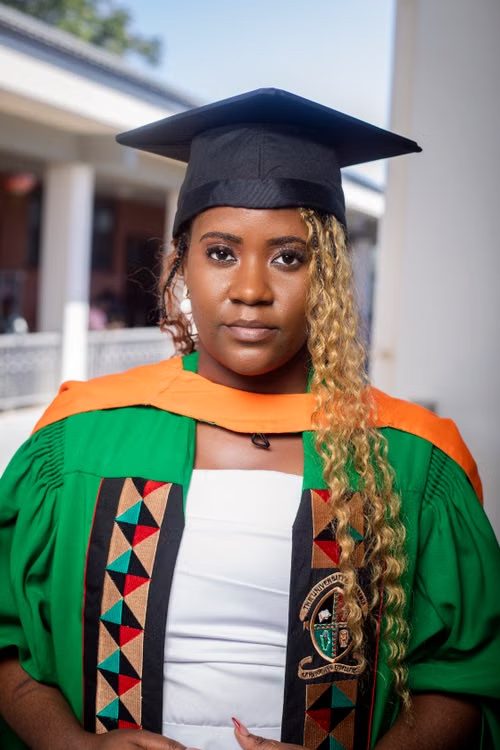 A Ugandan graduate in cap and gown